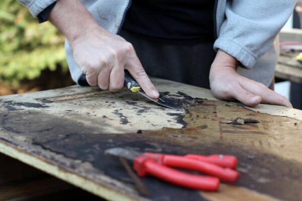 a man restoring old furniture